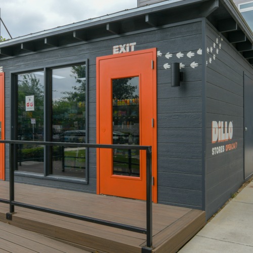 outside of black building store with red doors
